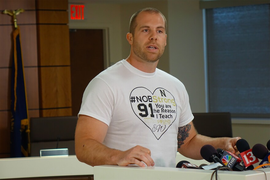 Seventh grade teacher Jason Seaman, who is credited with tackling the shooter at Noblesville West Middle School, speaks at a press conference Monday. (Eric Weddle/WFYI News)