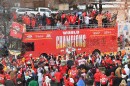 Kansas City Chiefs players drive down Grand Boulevard on a World Champions bus during the Super Bowl parade on Feb. 15, 2023.