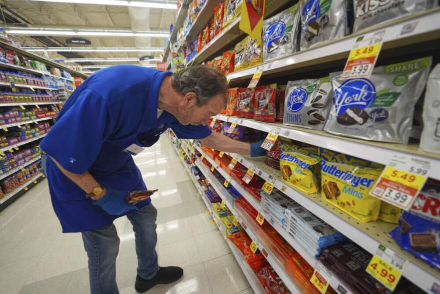 TJ Odum stocks a shelf in a grocery store in Dallas, Thursday, Aug. 28, 2025. (LM Otero/AP)