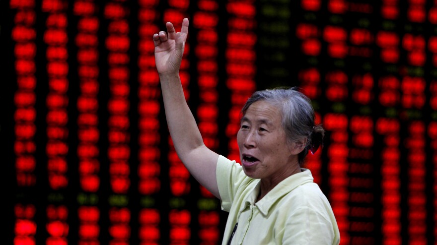 An investor is seen at a brokerage house in Shanghai, China, on Aug. 16.