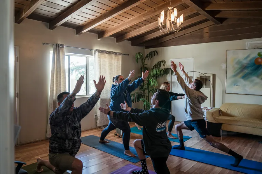 Cal Fire participants practice yoga during a healing retreat at the Nurturing Nest in Desert Hot Springs