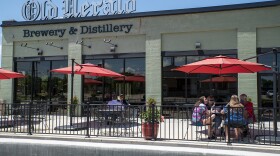 Patrons dine at the Old Herald Brewery and Distillery in Collinsville on May 29. The restaurant can serve customers in-person in phase three of Illinois' reopening plan.  05 29 2020