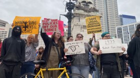 Protesters stand on Monument Circle Wednesday May 4, 2022.