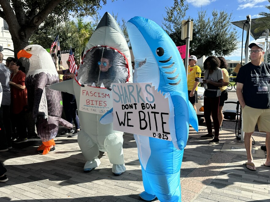 Many inflatable costumes like these sharks were seen at Orlando's No Kings rally outside City Hall on October 18th, 2025.
