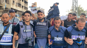Mourners and colleagues surround the bodies of Al-Jazeera journalists Ismail al-Ghoul and cameraman Rami al-Refee, both killed in an Israeli strike during their coverage of Gaza’s Al-Shati refugee camp, on July 31, 2024.