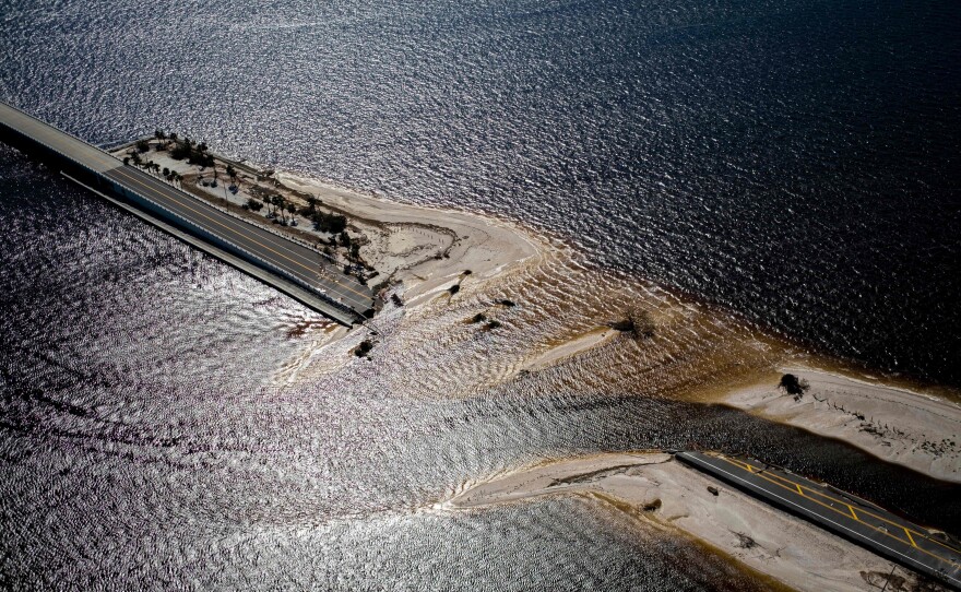 An aerial picture taken on Friday shows the collapsed Sanibel Causeway in the aftermath of Hurricane Ian in Sanibel, Fla.