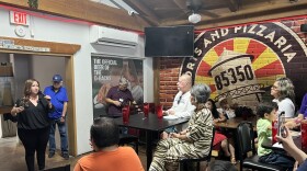Congressional candidate Adelita Grijalva, left, speaks to voters at the 85350 restaurant in Somerton on Saturday, Aug. 23.