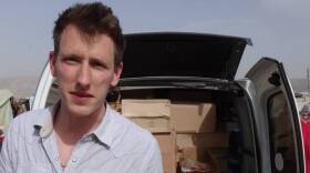 Kassig making a food delivery to refugees in Lebanonâ€™s Bekaa Valley, May 2013