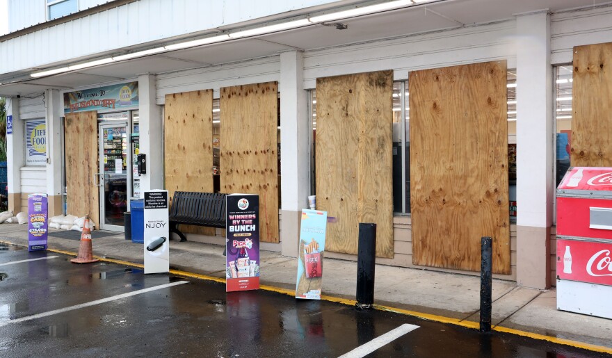 Store windows are boarded in Cedar Key in preparation for Hurricane Helene which is expected to make landfall as a Category 3 hurricane Thursday evening. (Azhalia Pottinger/WUFT News)