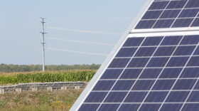 Solar array near transmission lines sited on farmland.