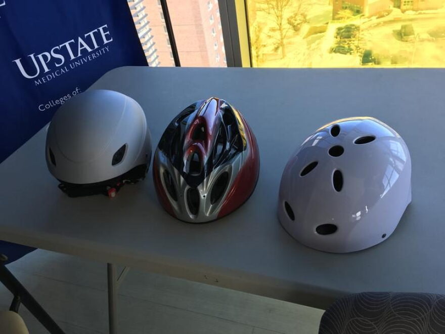 From left to right, a ski helmet, a bike helmet and a multi-sport helmet (not recommended for skiing or biking). TOM MAGNARELLI / WRVO PUBLIC MEDIA