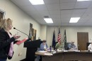 Antrim County resident addresses the county commission, including Victoria Bishop (second from left). (Photo: Claire Keenan-Kurgan/IPR)