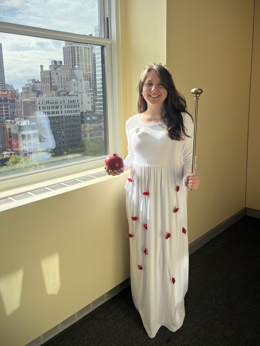 Using items you have at home can often result in a more creative costume than what you might buy at a Halloween store. Life Kit host Marielle Segarra dressed as The Empress from a tarot card deck for Halloween in 2022 using a curtain rod from home as a scepter and pomegranate seed earrings she already owned.