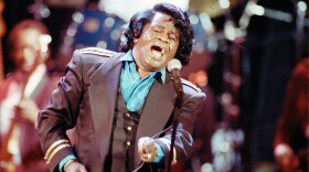 Gospel-soul singer James Brown sings "Living in America" during his three-hour concert at the Wiltern Theater in Los Angeles, Ca., on June 10, 1991. The concert, titled "Living in America," is broadcast as a pay-per-view show on cable television. Brown, the "Godfather of Soul," died early Monday, Dec. 25, 2006. He was 73. (AP Photo/Kevork Djansezian)