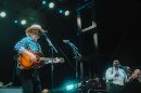 Bon Iver frontman Justin Vernon plays guitar and sings Bob Dylan covers to headline the first night at Eaux Claires Festival 2026.