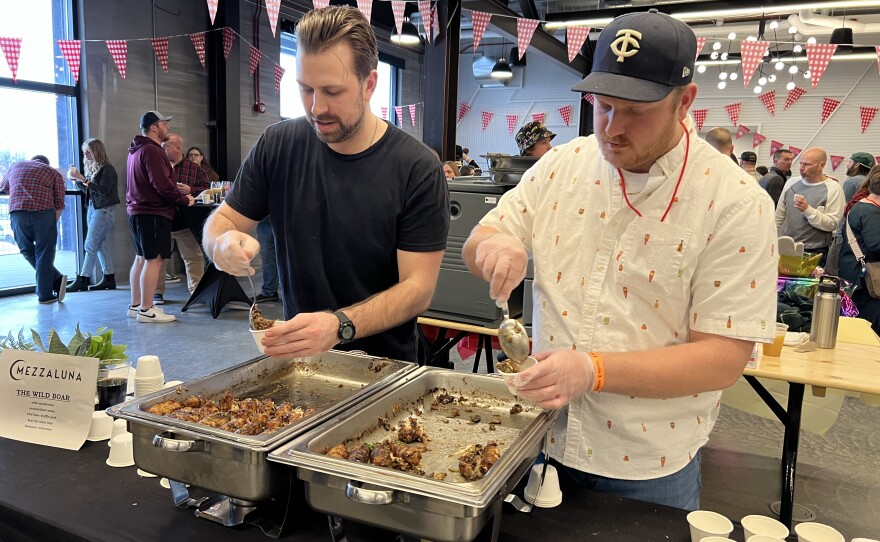 Mezzaluna serves their "Wild Boar" hotdish at the Fargo Hotdish Festival.