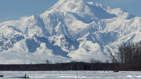 A large snowy mountain viewed on a clear day