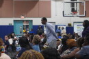 An attendee takes the microphone to voice his concerns as county officials field questions during the Oct. 8 meeting at the NFL YET Center.