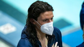 Pennsylvania's Lia Thomas is shown during the playing of the national anthem before a swim meet, Saturday, Jan. 8, 2022, in Philadelphia. The NCAA has adopted a sport-by-sport approach for transgender athletes, bringing the organization in line with the U.S. and International Olympic Committees. NCAA rules on transgender athletes returned to the forefront when Penn swimmer Lia Thomas started smashing records this year.(AP Photo/Chris Szagola)
