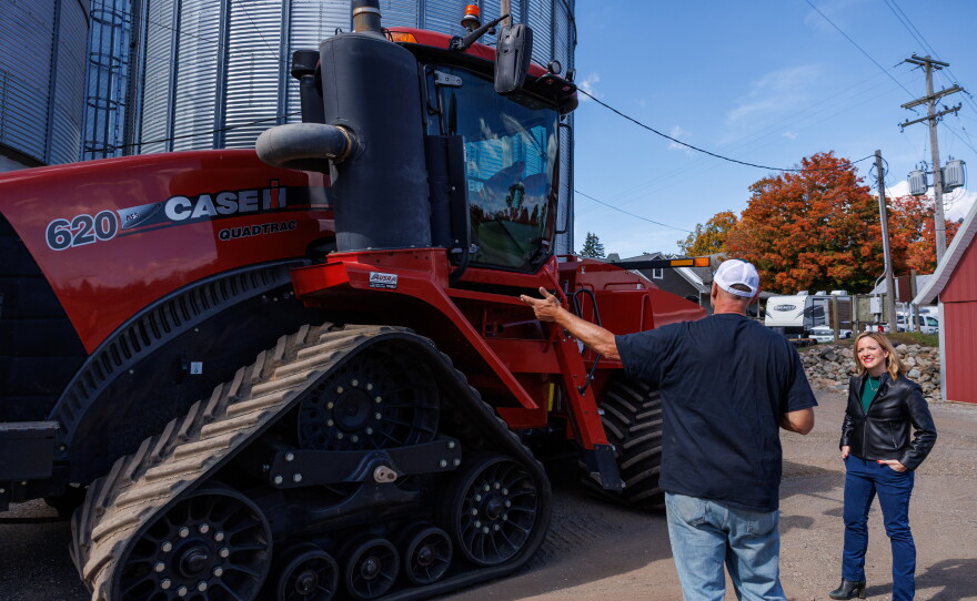 Secretary of State Jocelyn Benson, the Democratic nominee for governor, learns about farm equipment after a news conference at Shady Lodge Farm in Lansing, Mich., on Oct. 8, 2026.