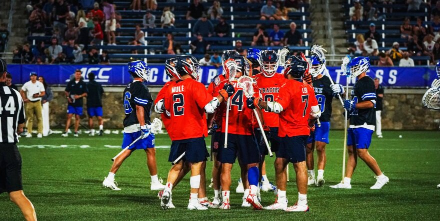 No. 3 Syracuse celebrated after a Jake Stevens (14, Orange) second quarter goal to trim the deficit to four.