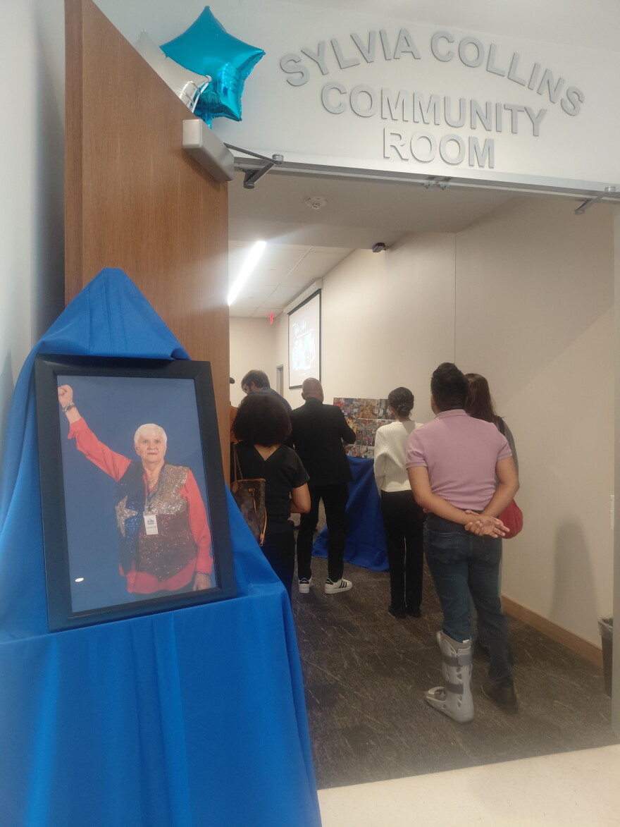 Attendees walk in the Sylvia Collins Community Room after the dedication Tuesday morning at the Oak Cliff Government Center.