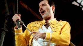 FILE - In this July 20, 1986 file photo, Queen lead singer Freddie Mercury performs, in Germany. Queen guitarist Brian May says an asteroid in Jupiter's orbit has been named after the band's late frontman Freddie Mercury on what would have been his 70th birthday, it was reported on Monday, Sept. 5, 2016. May says the International Astronomical Union's Minor Planet Centre has designated an asteroid discovered in 1991, the year of Mercury's death, as "Asteroid 17473 Freddiemercury." (AP Photo/Marco Arndt, File)