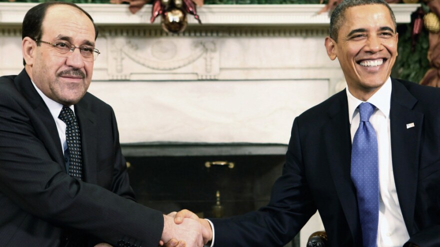 Iraqi Prime Minister Nouri al-Maliki shakes hands with President Obama in the Oval Office at the White House on Monday. The two leaders met as the U.S. prepares to withdraw the last of its combat troops from Iraq.