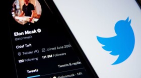 A Twitter logo seen displayed on a smartphone screen with now-owner Elon Musk. (Photo by Nikolas Kokovlis/NurPhoto via Getty Images)