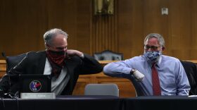US Senators Tim Kaine (D-VA) and Richard Burr (R-NC) greet each other with an elbow bump before the Senate Committee for Health, Education, Labor, and Pensions hearing to examine COVID-19 and Safely Getting Back to Work and Back to School in Washington, DC.
