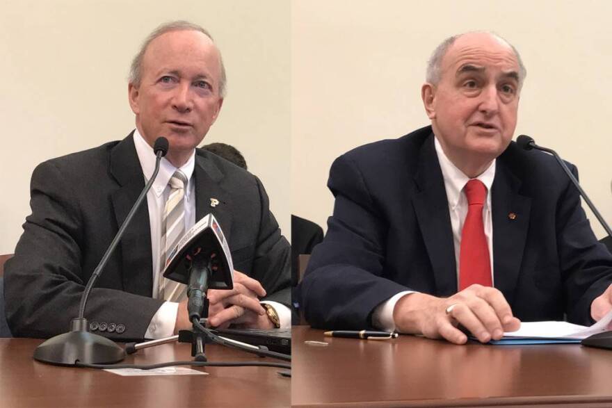 Purdue University President Mitch Daniels (left) and Indiana University President Michael McRobbie (right) address lawmakers in a Senate budget hearing.