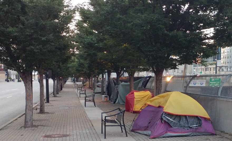 Several tents housing the homeless line Third Street in Downtown Cincinnati.