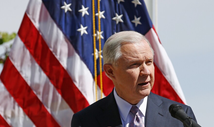 Attorney General Jeff Sessions speaks at a news conference after touring the U.S.-Mexico border on April 11. The Justice Department is warning so-called sanctuary cities that they must prove they are complying with federal immigration laws or risk funding.