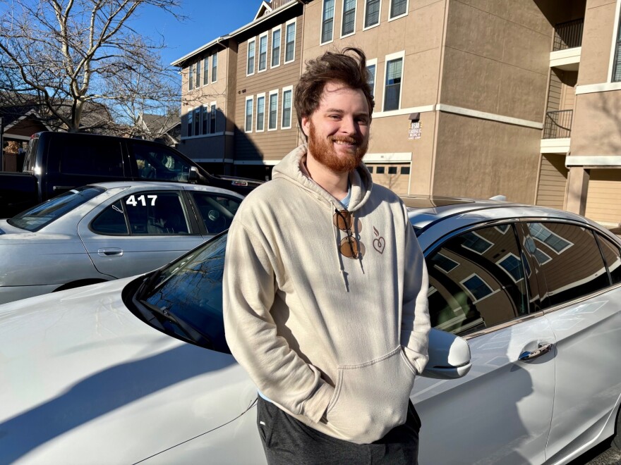 Ashworth stands in front of the car that was seen on Lenexa PD license plate reader