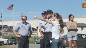 Actors playing corrections officers get instructions from a member of Ben Stiller's production crew on Wednesday. (Zach Hirsch/North Country Public Radio)