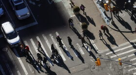Pedestrians move past the Port Authority Bus Terminal in New York, New York. 