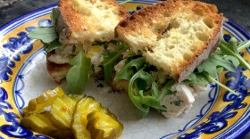 Kathy's chicken salad sandwich with arugula and pickles. (Kathy Gunst for Here & Now)