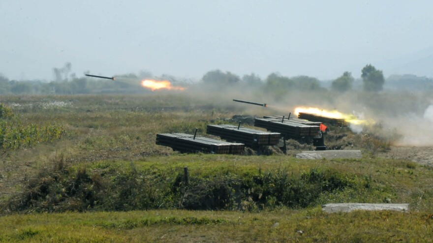 North Korea's military fires missiles during a drill in this undated photo released Oct. 6, 2010, by the Korean Central News Agency. North Korea has agreed to stop nuclear activities and allow inspections, while the U.S. says it will provide food aid to the country.