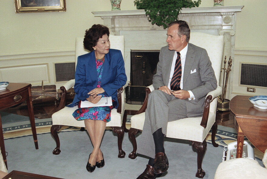 U.S. President George H. Bush meets with Small Business Administration Administrator Pat Saiki, Thursday, Sept. 3, 1992 in the Oval Office of the White House. The meeting was to discuss hurricane relief efforts in Florida and Louisiana.
