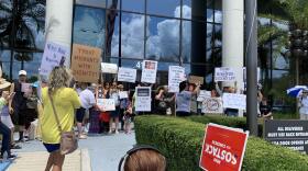 Protesters lined up in front of U.S. Rep Kathy Castor's office on Tuesday for a "Close the Camps" rally, aimed at shutting down immigration detention centers earlier this year.. 