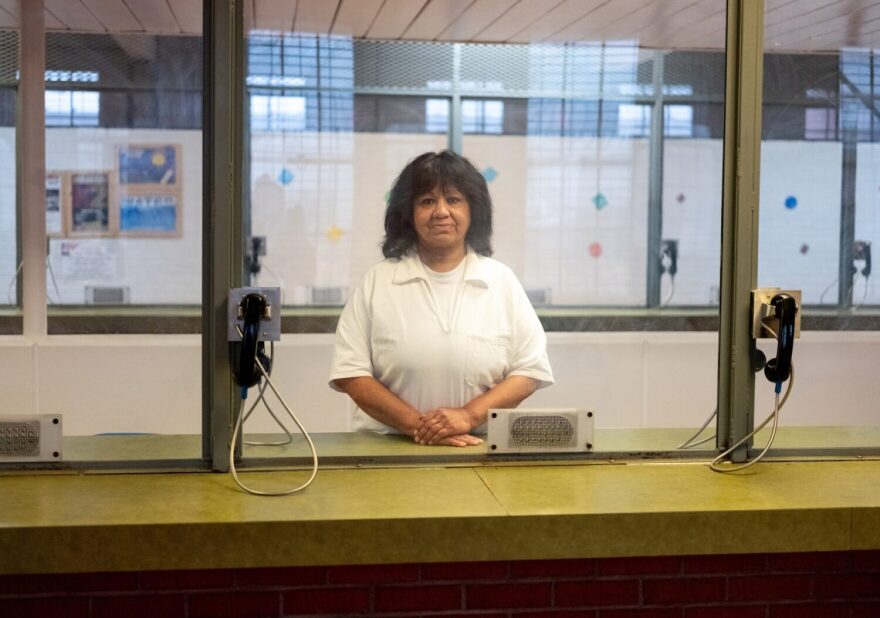 Melissa Lucio stands in the visitation area of a Texas federal prison.