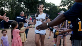 Gabby Rodriguez, shortstop for The Milford Little League 12U Softball team, is congratulated by fans during a rally ahead of the team's trip to Greenville, NC to compete in the Little League Softball World Series.