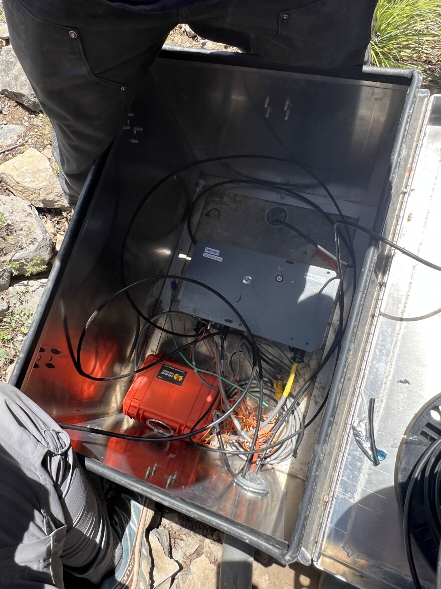 The seismic sensor itself is a small, insignificant-looking box tucked away in a bigger metal box. But it’s mighty – and very sensitive, detecting ground movement miles away.