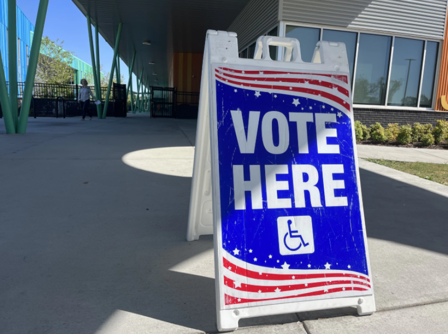 A "vote here" sign sits outside a polling location in Baton Rouge on Oct. 14, 2023.