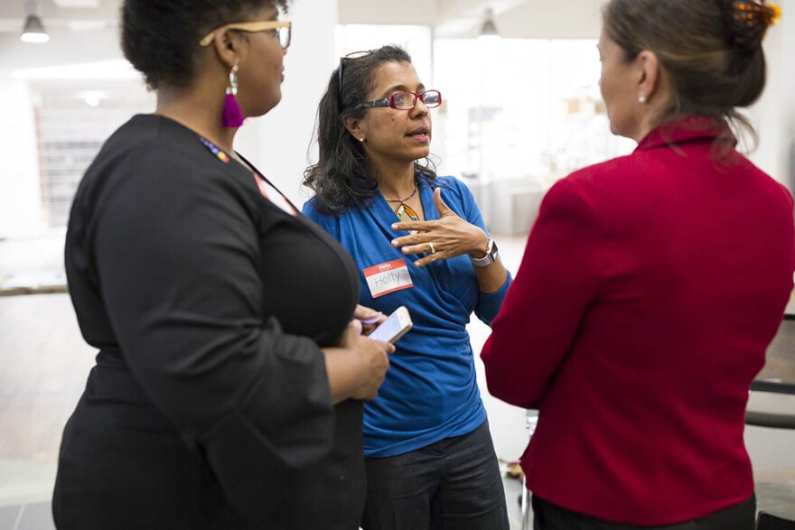 Mavis Gragg, left, and Holly Ewell-Lewis, center, talk with Anita Earls, right, a candidate for the North Carolina Supreme Court during a Sister to Sister salon conversation at the Chesterfield in Durham on Friday, October 26, 2018.