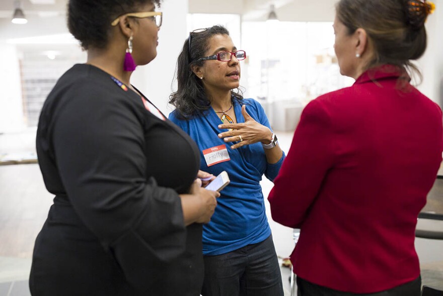 Mavis Gragg, left, and Holly Ewell-Lewis, center, talk with Anita Earls, right, a candidate for the North Carolina Supreme Court during a Sister to Sister salon conversation at the Chesterfield in Durham on Friday, October 26, 2018. 