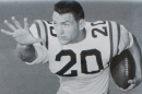 This image is a photo of Billy Cannon that was originally released in a press packet by Louisiana State University (LSU) to promote their football team. It is used in a Wikipedia article about him to demonstrate how he looked while playing football for LSU.