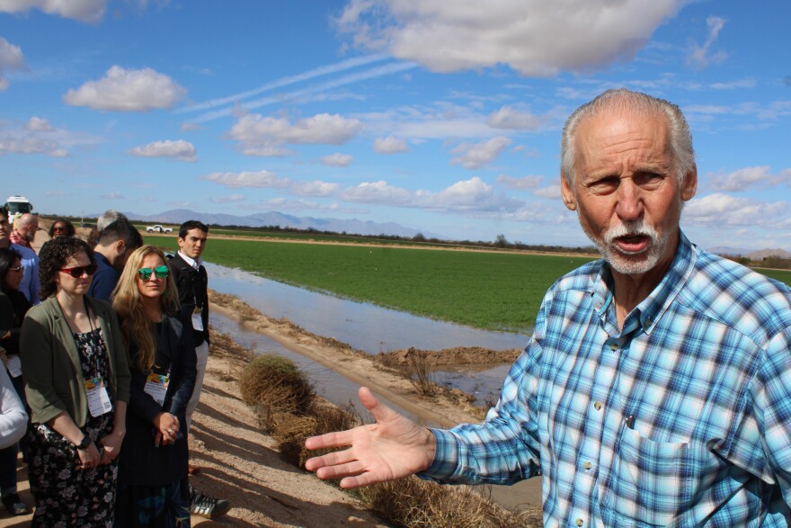 David DeJong speaks to a tour group on the Gila River Indian Community reservation in Arizona on February 17, 2026. Corporations helped fund a new irrigation system for GRIC's alfalfa fields.