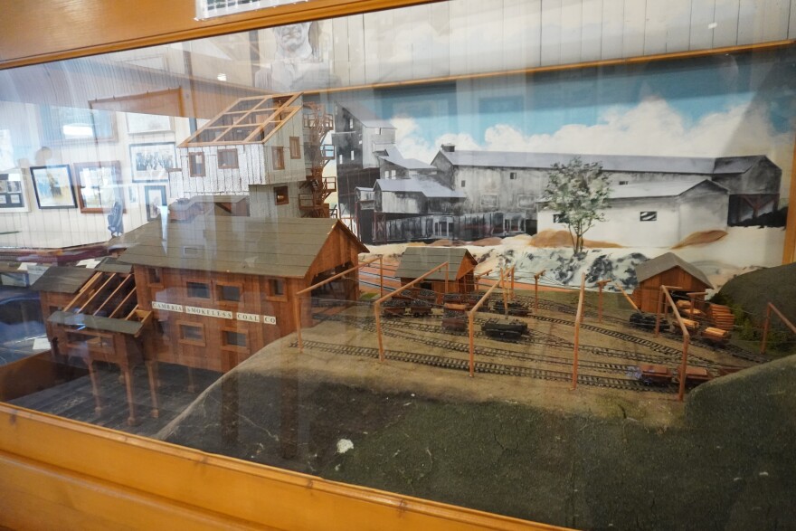 This model of the Sunshine Mine represents the tipple where coal was processed and the rail cars carrying coal out of the mines. 