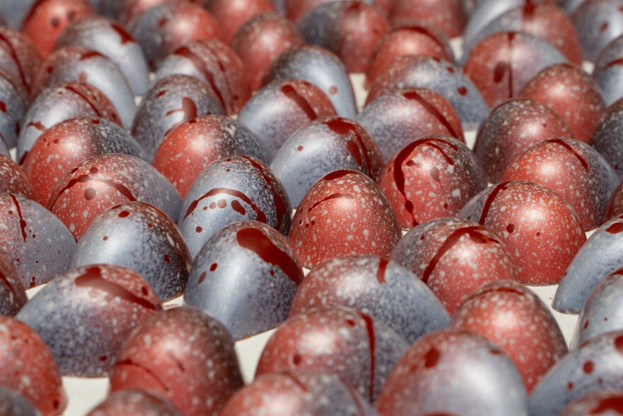 Hand-painted chocolates ready for packaging.